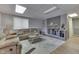 Finished basement featuring a gray brick fireplace and comfortable seating at 7438 Haw Dr, Nineveh, IN 46164