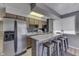 Small basement kitchen with stainless steel appliances and breakfast bar at 7438 Haw Dr, Nineveh, IN 46164