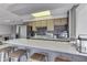 Basement kitchenette with stainless steel appliances and a breakfast bar at 7438 Haw Dr, Nineveh, IN 46164