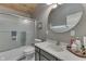 Clean bathroom with a large vanity and a shower/tub combo at 7438 Haw Dr, Nineveh, IN 46164