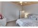 Main bedroom with floral bedding and a white wicker vanity at 7438 Haw Dr, Nineveh, IN 46164
