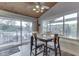 Lake view dining area with table for four and access to balcony at 7438 Haw Dr, Nineveh, IN 46164