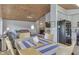 Bright dining area with wood table and seating for four, adjacent to kitchen and living room at 7438 Haw Dr, Nineveh, IN 46164