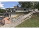Lakefront home with stone retaining wall and patio at 7438 Haw Dr, Nineveh, IN 46164