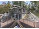 Two-story lakefront home with large deck and multi-level patio at 7438 Haw Dr, Nineveh, IN 46164