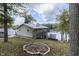 Lakefront home with landscaped yard and firepit at 7438 Haw Dr, Nineveh, IN 46164