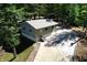 Small guest house with metal roof and paved driveway at 7438 Haw Dr, Nineveh, IN 46164