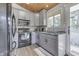 Modern kitchen with gray cabinets, granite countertops and black appliances at 7438 Haw Dr, Nineveh, IN 46164
