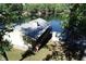 Lake house with metal roof and deck overlooking the lake at 7438 Haw Dr, Nineveh, IN 46164