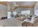 Open concept living room with vaulted ceiling, large windows, and comfortable seating at 7438 Haw Dr, Nineveh, IN 46164
