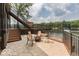 Cozy patio with fire pit and seating, overlooking the lake at 7438 Haw Dr, Nineveh, IN 46164