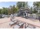 Spacious lakefront deck with lounge chairs and seating at 7438 Haw Dr, Nineveh, IN 46164