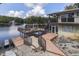 Expansive deck overlooks lake; steps lead to the water at 7438 Haw Dr, Nineveh, IN 46164