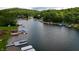 Aerial view of a calm lake and waterfront homes, highlighting peaceful lakeside living at 4161 S Summit Ln, Columbus, IN 47201