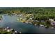 Scenic aerial view of lakefront homes nestled along the wooded shoreline at 4161 S Summit Ln, Columbus, IN 47201