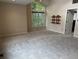 Bright bedroom featuring transom window and adjacent bathroom at 4161 S Summit Ln, Columbus, IN 47201