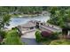 Elegant lakeside home features a well-maintained lawn, private dock, and scenic waterfront views at 4161 S Summit Ln, Columbus, IN 47201