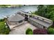 Beautifully landscaped lakeside property with a private dock, attached garage, and tranquil lake views at 4161 S Summit Ln, Columbus, IN 47201