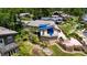 Overhead shot of a lake house, showcasing a deck, stone landscaping, and lakefront access at 4161 S Summit Ln, Columbus, IN 47201