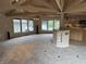 Expansive living room featuring large windows, vaulted ceilings, and easy access to the kitchen area at 4161 S Summit Ln, Columbus, IN 47201