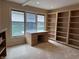 Bright office featuring built-in shelving and a large window offering a lake view at 4161 S Summit Ln, Columbus, IN 47201