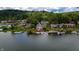 Picturesque waterfront homes with docks nestled along the serene lake surrounded by dense foliage at 4161 S Summit Ln, Columbus, IN 47201