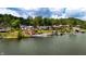 Stunning waterfront homes with private docks line the tranquil lake surrounded by lush greenery at 4161 S Summit Ln, Columbus, IN 47201