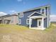 Expansive backyard showcasing a covered patio, perfect for enjoying the outdoors at 1537 Hanover St, Danville, IN 46122