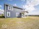 Spacious backyard featuring a covered patio, ideal for outdoor entertaining and relaxation at 1537 Hanover St, Danville, IN 46122