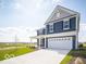 Charming two-story home featuring a spacious driveway and manicured front lawn at 1537 Hanover St, Danville, IN 46122
