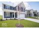 Inviting two-story home with a well-maintained lawn and proximity to neighboring houses at 1537 Hanover St, Danville, IN 46122