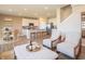 Open concept kitchen features white cabinets, stainless steel appliances, and an island with seating at 1537 Hanover St, Danville, IN 46122