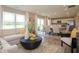 Open living room showcasing a sectional sofa, coffee table, and adjacent dining area with kitchen views at 1543 Hanover St, Danville, IN 46122