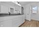 Bright bathroom with a double sink vanity, modern fixtures, and sleek countertop at 5143 Rolling Meadow Blvd, Indianapolis, IN 46237