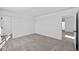 Bedroom with open doorway, closet, neutral carpet, and a view to another room at 5143 Rolling Meadow Blvd, Indianapolis, IN 46237