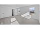 Bright bedroom with plush carpet, many windows, and an open doorway at 5143 Rolling Meadow Blvd, Indianapolis, IN 46237