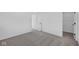 Bedroom features neutral carpeting, an open doorway, and closet with wire shelving at 5143 Rolling Meadow Blvd, Indianapolis, IN 46237
