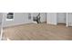 Spacious living room features wood floors, staircase, and ample natural light from the windows at 5143 Rolling Meadow Blvd, Indianapolis, IN 46237