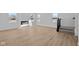 Bright living room showcases wood floors, a modern fireplace, and staircase at 5143 Rolling Meadow Blvd, Indianapolis, IN 46237