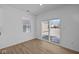 Living room boasts wood floors, a sliding glass door to the back, and a large window at 5143 Rolling Meadow Blvd, Indianapolis, IN 46237