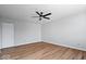 Light-filled bedroom with ceiling fan, closet and hardwood floors offer comfort and functionality at 6840 Minnow Dr, Indianapolis, IN 46237