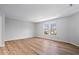 Bright bedroom with hardwood floors and a window, offering a serene and inviting atmosphere at 6840 Minnow Dr, Indianapolis, IN 46237