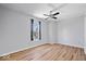 Bedroom features ceiling fan, hardwood floors and a window, making it an inviting space at 6840 Minnow Dr, Indianapolis, IN 46237