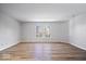 Spacious bedroom features a large window offering plenty of natural light and beautiful hardwood floors at 6840 Minnow Dr, Indianapolis, IN 46237