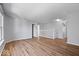 Spacious living room with hardwood floors, neutral walls and staircase access to the next level at 6840 Minnow Dr, Indianapolis, IN 46237