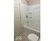 Bathroom features a bathtub with white tile surround, perfect for relaxation and convenience at 237 Ringwood Way, Anderson, IN 46013