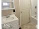 Bathroom features a modern vanity with a sink and updated fixtures, offering functionality and style at 237 Ringwood Way, Anderson, IN 46013