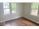 Cozy bedroom featuring hardwood floors, white trim, and lots of natural light at 237 Ringwood Way, Anderson, IN 46013