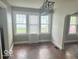 Dining room featuring hardwood floors, natural light from the windows, and an industrial style light fixture at 237 Ringwood Way, Anderson, IN 46013