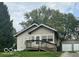 Charming single-Gathering home with covered front porch and a detached two car garage at 237 Ringwood Way, Anderson, IN 46013